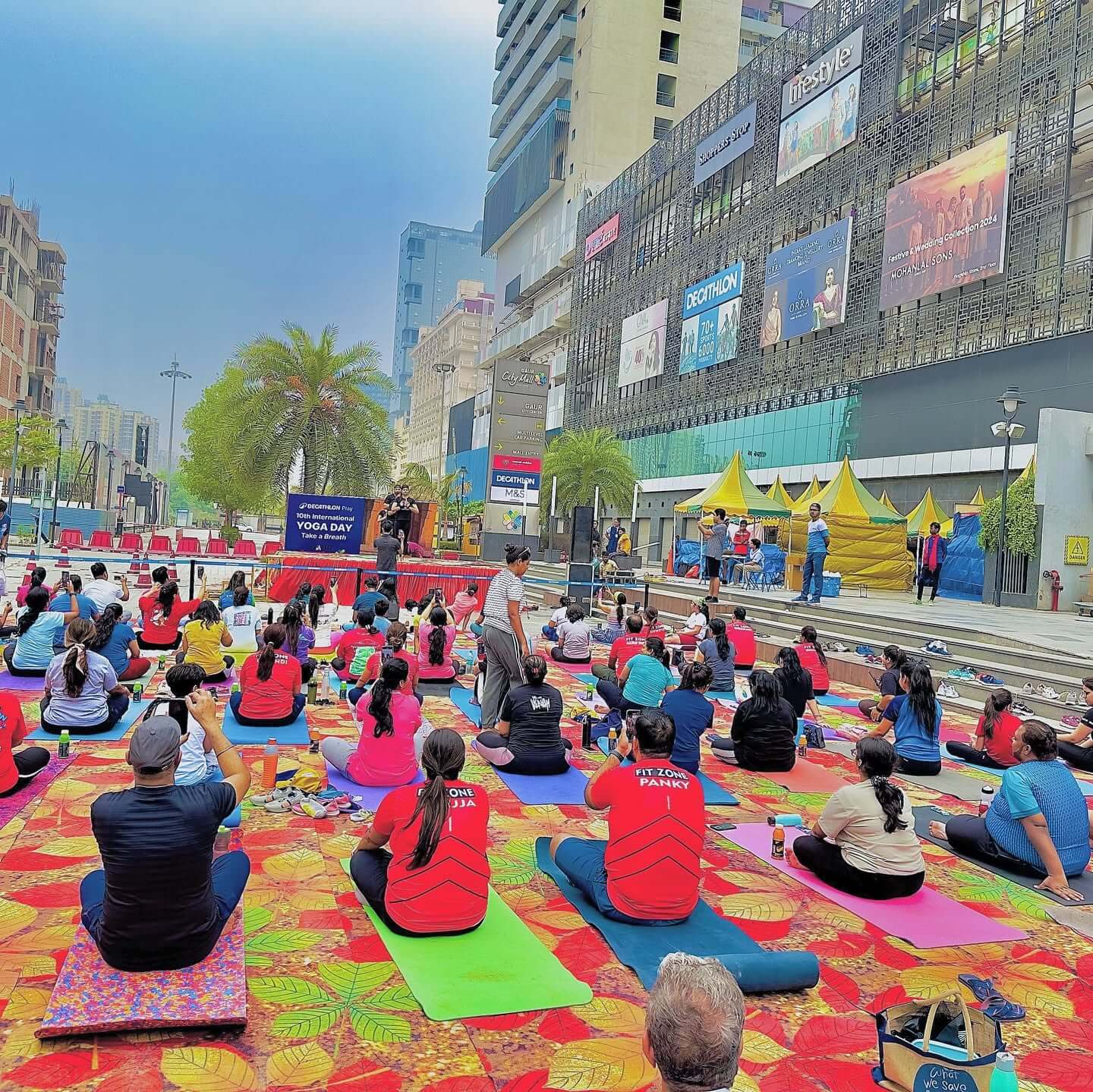 People celebrating International Yoga Day at Gaur City Mall Greater Noida West